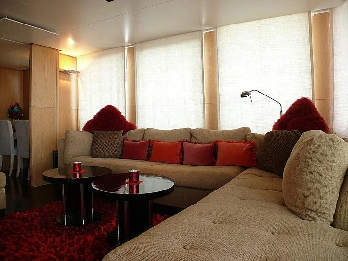 a living room with a white couch aboard ALTER EGO Yacht for Sale