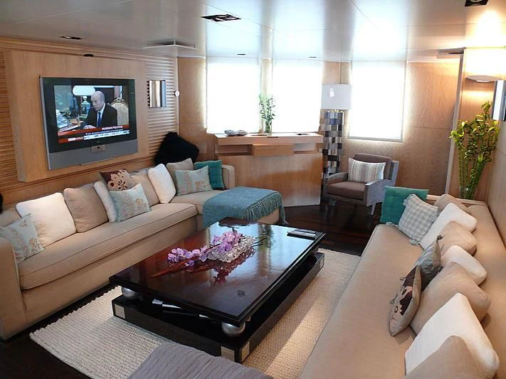 a living room with a large screen aboard ALTER EGO Yacht for Sale