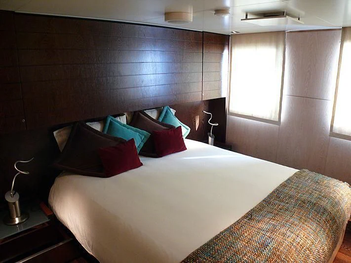 a bed with pillows and pillows aboard ALTER EGO Yacht for Sale