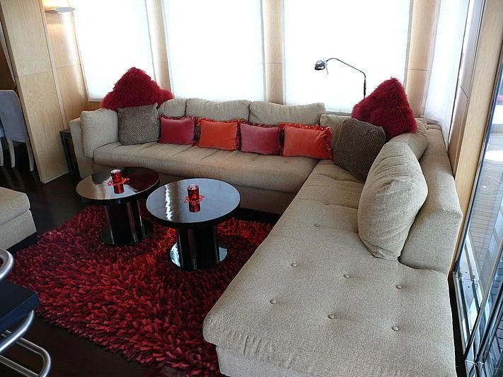 a living room with a couch and a coffee table aboard ALTER EGO Yacht for Sale