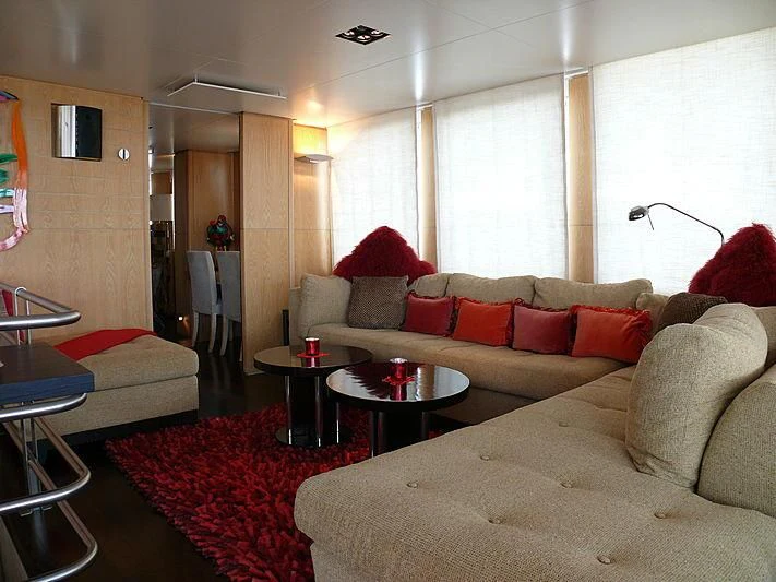 a living room with a couch and a table aboard ALTER EGO Yacht for Sale