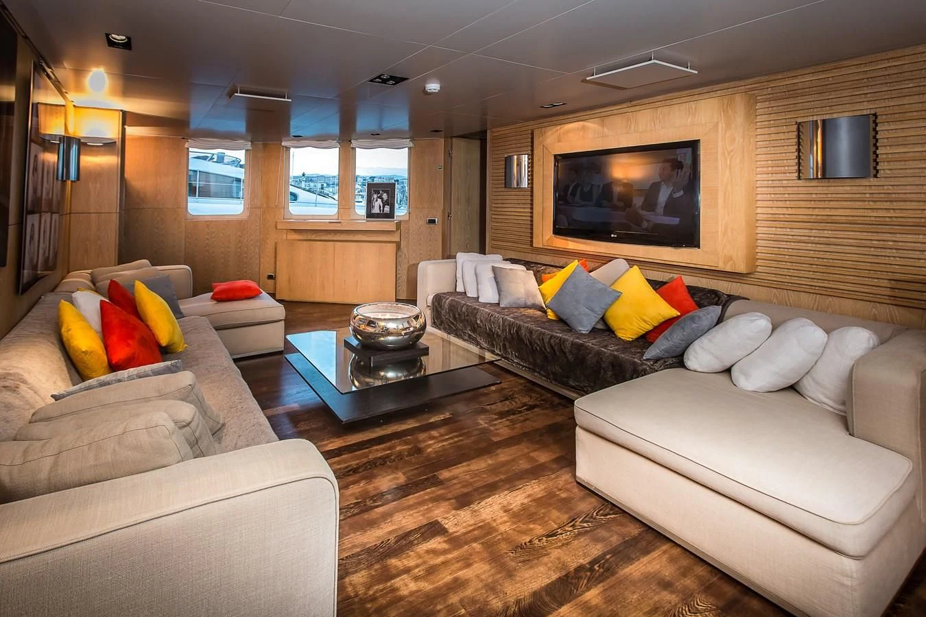 a living room with couches and a coffee table aboard ALTER EGO Yacht for Sale