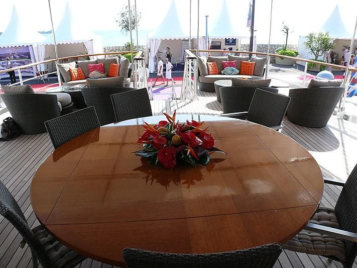 a table with a flower arrangement on it aboard ALTER EGO Yacht for Sale