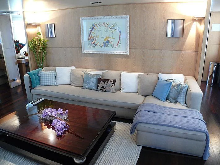 a living room with a couch and a table aboard ALTER EGO Yacht for Sale