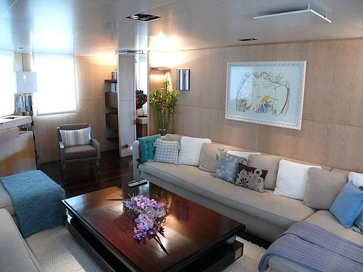 a living room with a couch and a coffee table aboard ALTER EGO Yacht for Sale