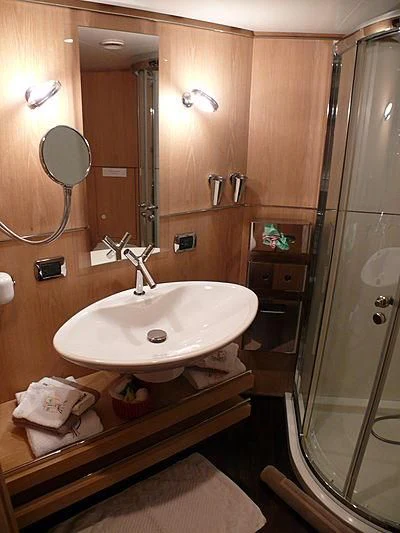 a bathroom with a sink and a shower aboard ALTER EGO Yacht for Sale