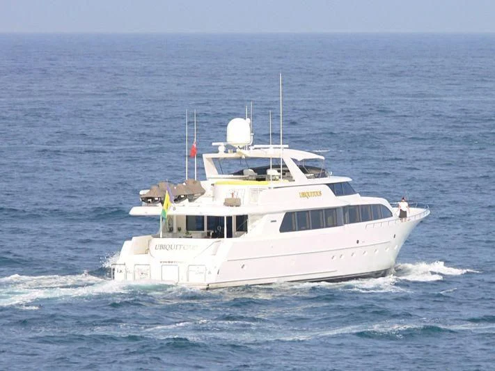 a white boat on the water aboard THE JOB Yacht for Sale
