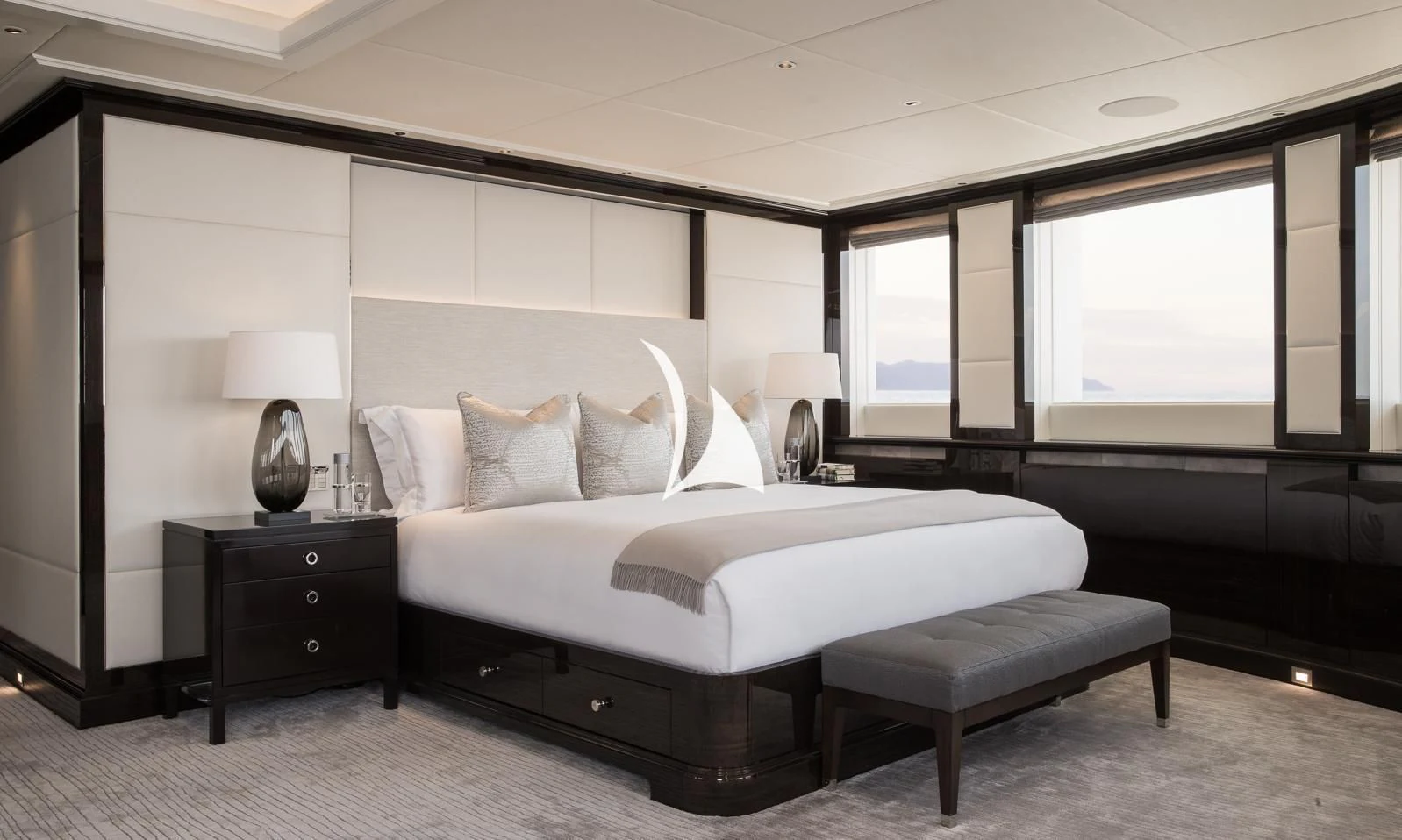 a large bedroom with a large bed aboard AQUILA Yacht for Sale