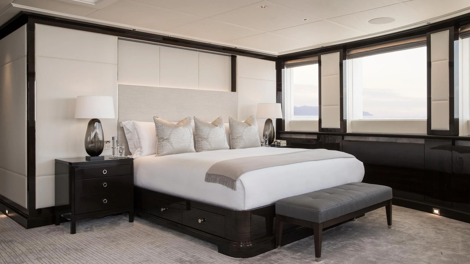a large bed in a room aboard AQUILA Yacht for Sale