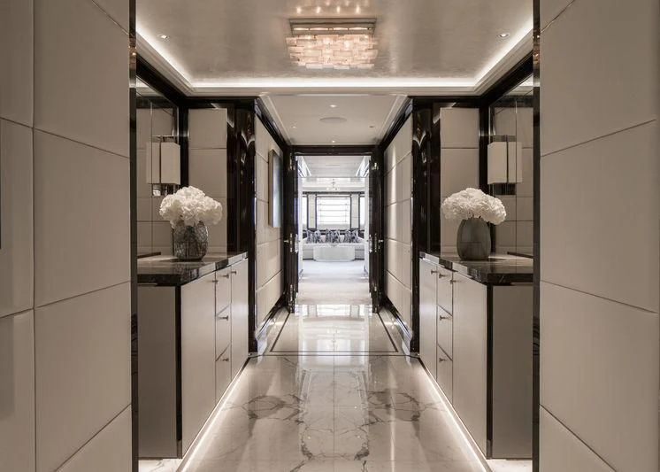 a hallway with a glass door aboard AQUILA Yacht for Sale