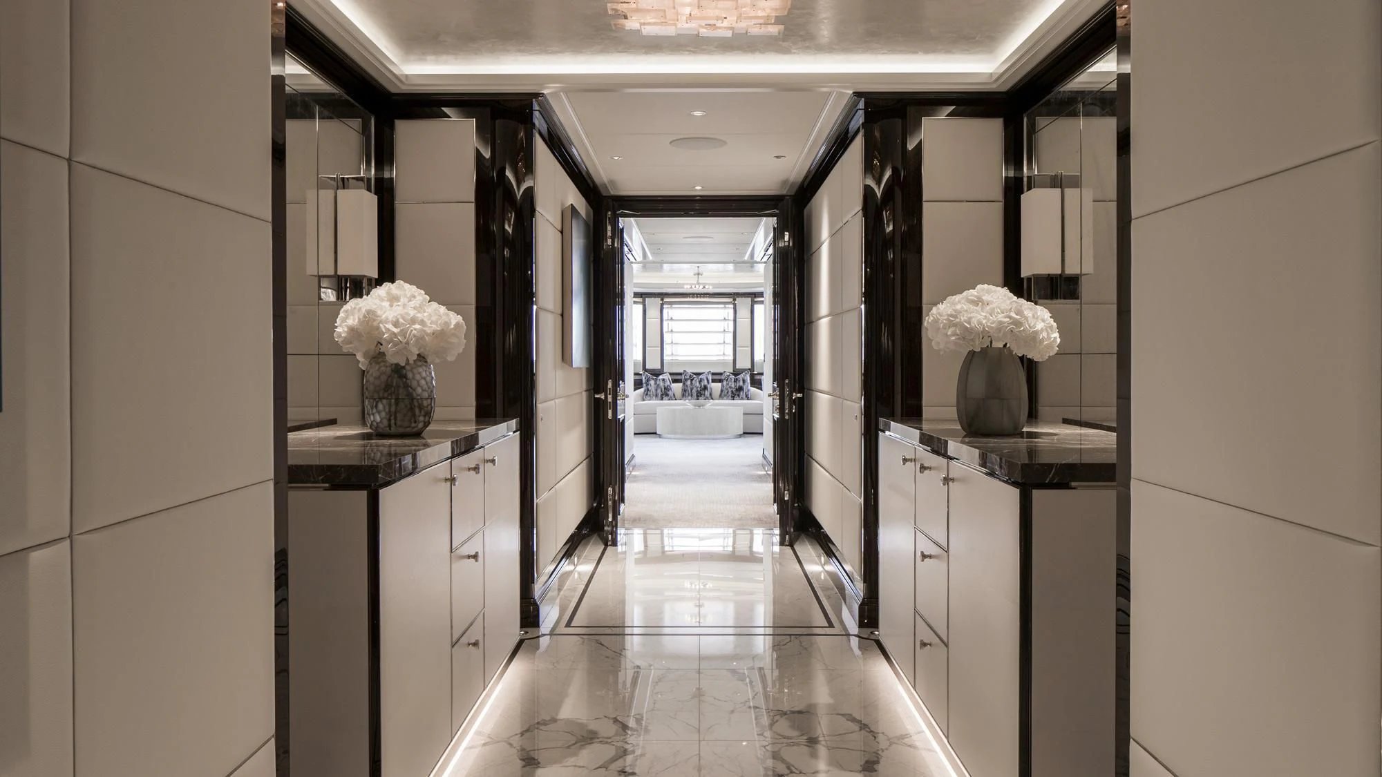 a hallway with white flowers aboard AQUILA Yacht for Sale