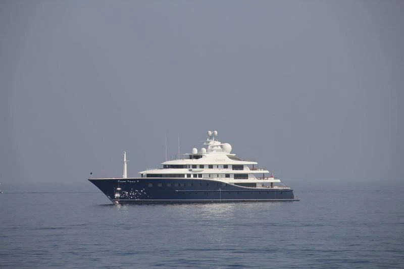 a large white boat in the water aboard AQUILA Yacht for Sale