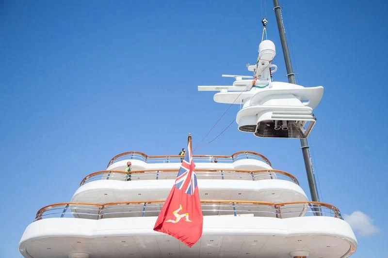 a couple of white boats with red flags on the front aboard AQUILA Yacht for Sale