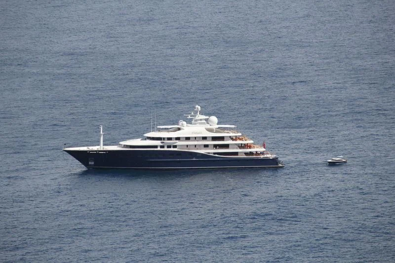 a large white boat in the water aboard AQUILA Yacht for Sale