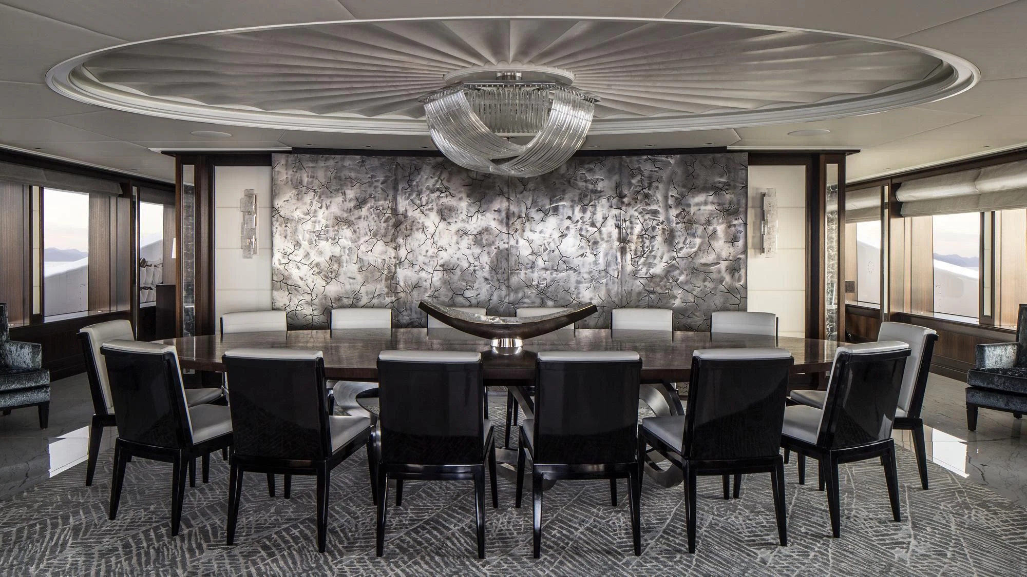 a large room with a table and chairs aboard AQUILA Yacht for Sale