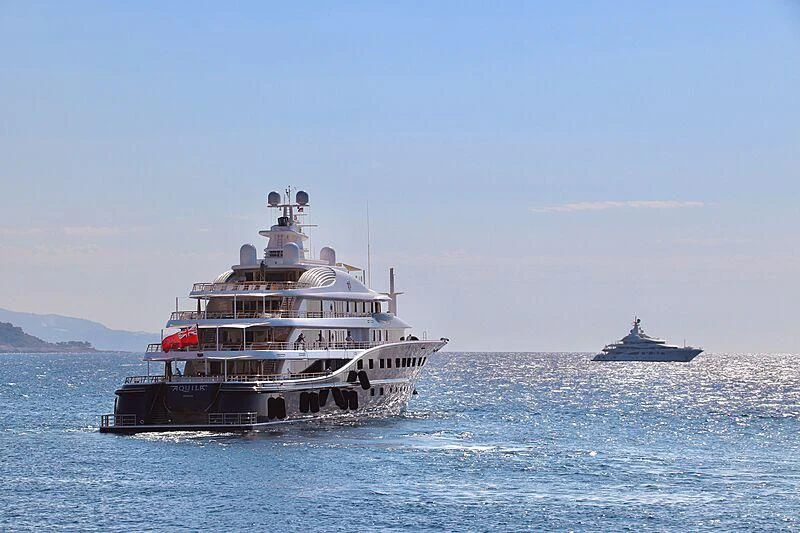 a large boat in the water aboard AQUILA Yacht for Sale