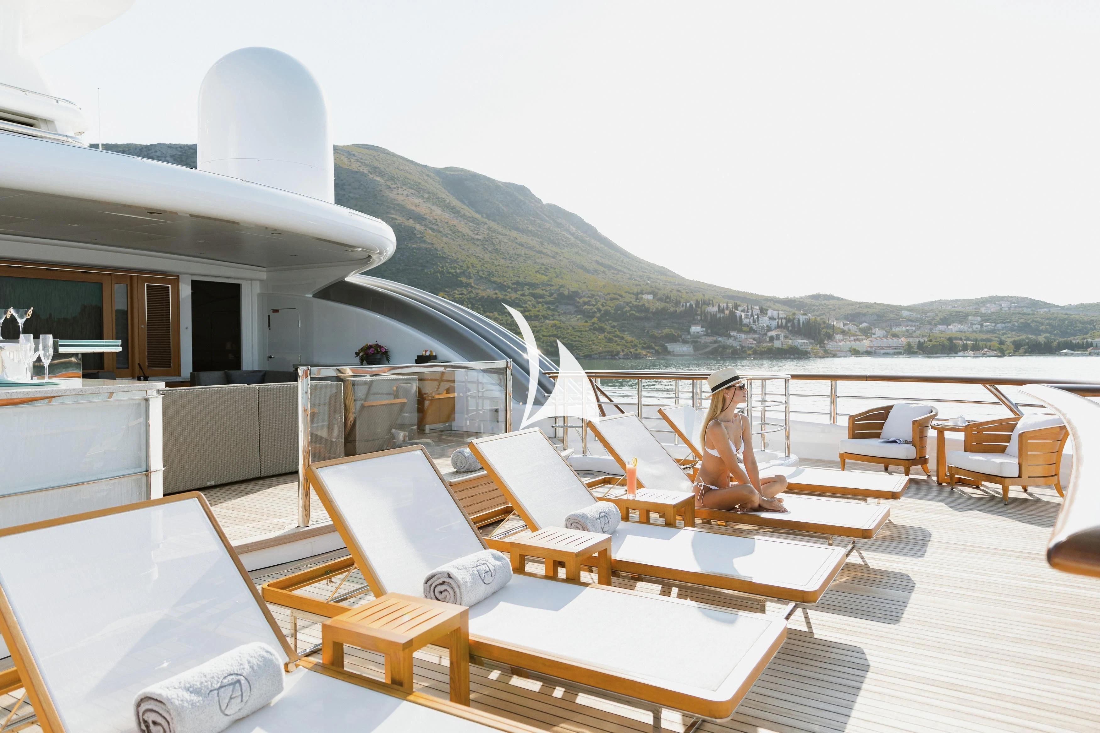 a room with a view of the mountains and the ocean aboard AQUILA Yacht for Sale
