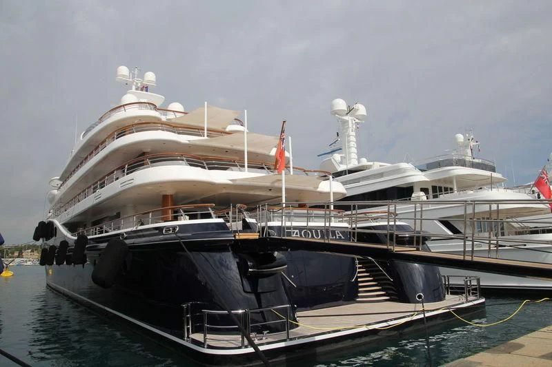 a large ship docked aboard AQUILA Yacht for Sale