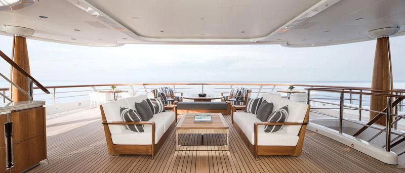 a large room with a couch and a table aboard AQUILA Yacht for Sale