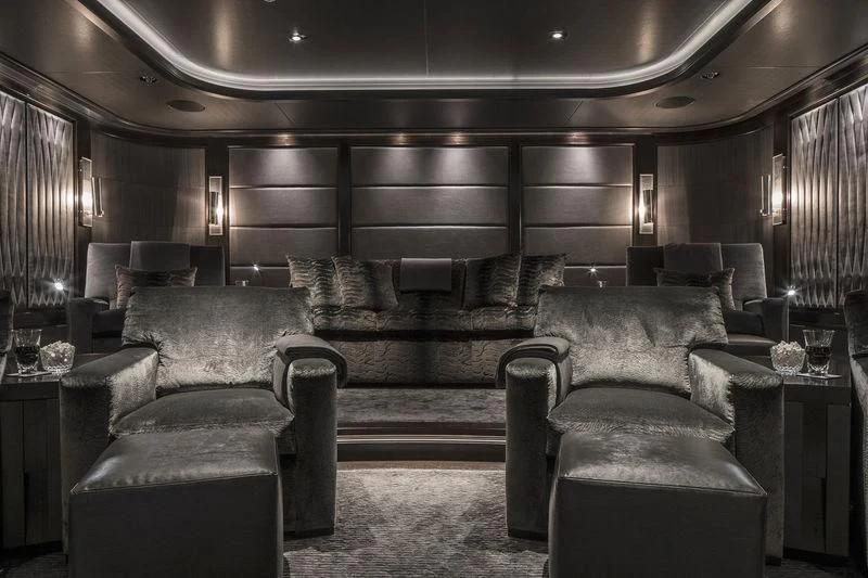 a living room with leather couches aboard AQUILA Yacht for Sale