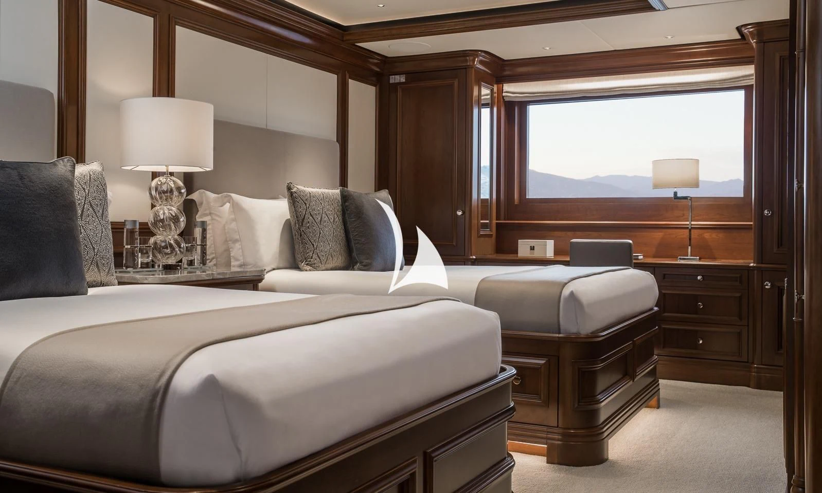 a hotel room with a bed and a desk aboard AQUILA Yacht for Sale