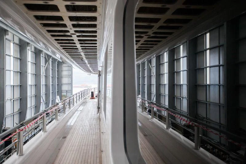 a walkway with glass walls aboard AQUILA Yacht for Sale