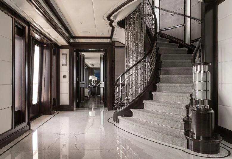 a long hallway with stairs aboard AQUILA Yacht for Sale