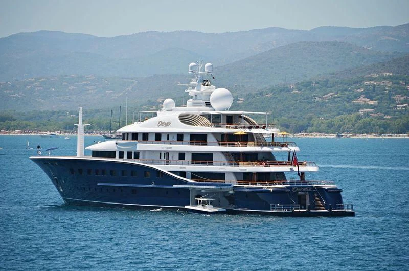 a large white boat in the water aboard AQUILA Yacht for Sale