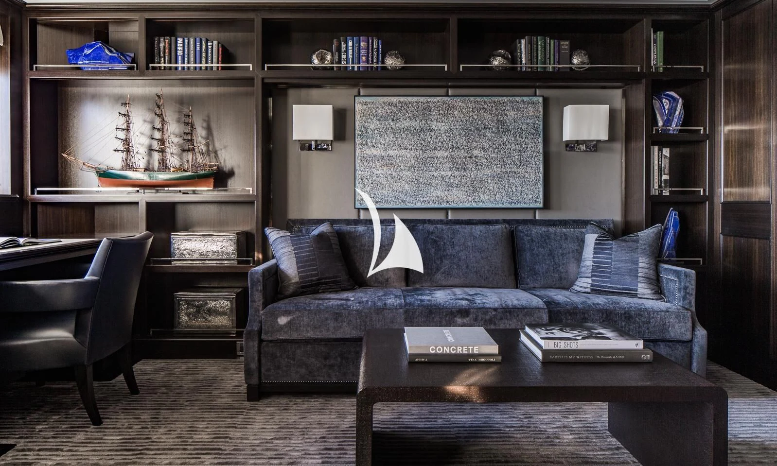 a living room with a couch and a table aboard AQUILA Yacht for Sale