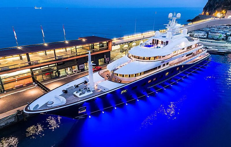 a large ship docked at a port aboard AQUILA Yacht for Sale