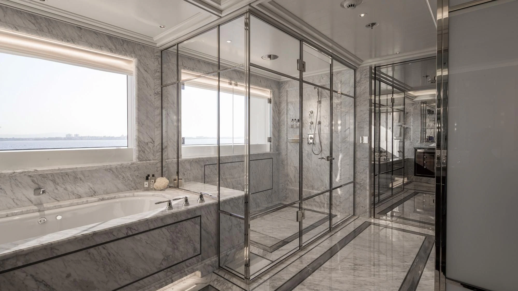 a bathroom with a tub and shower aboard AQUILA Yacht for Sale