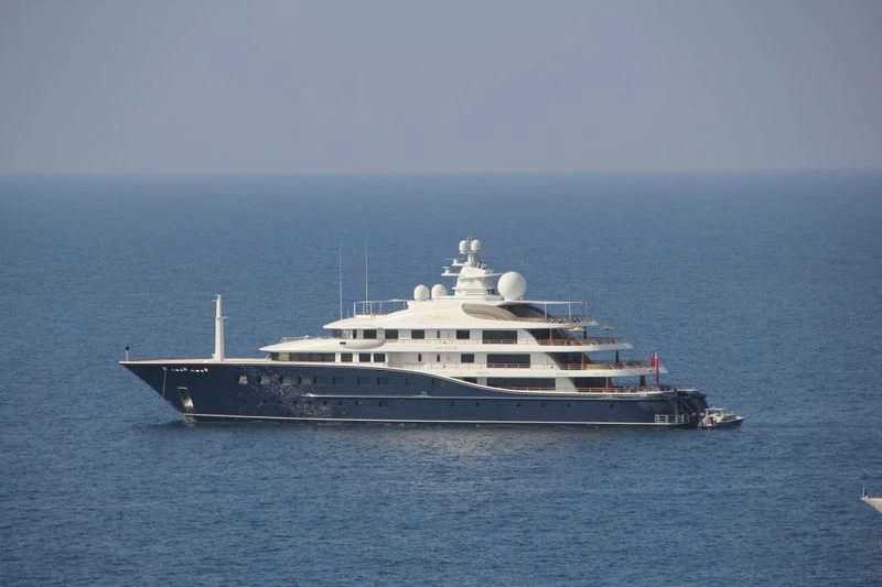 a large white ship in the water aboard AQUILA Yacht for Sale