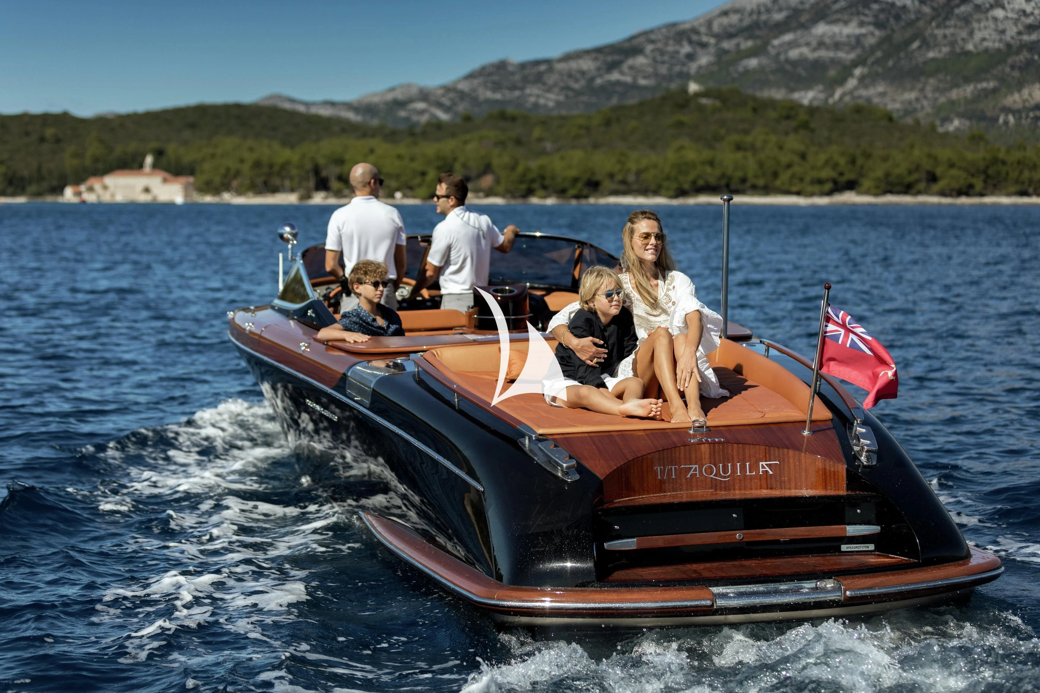 a group of people in a boat aboard AQUILA Yacht for Sale
