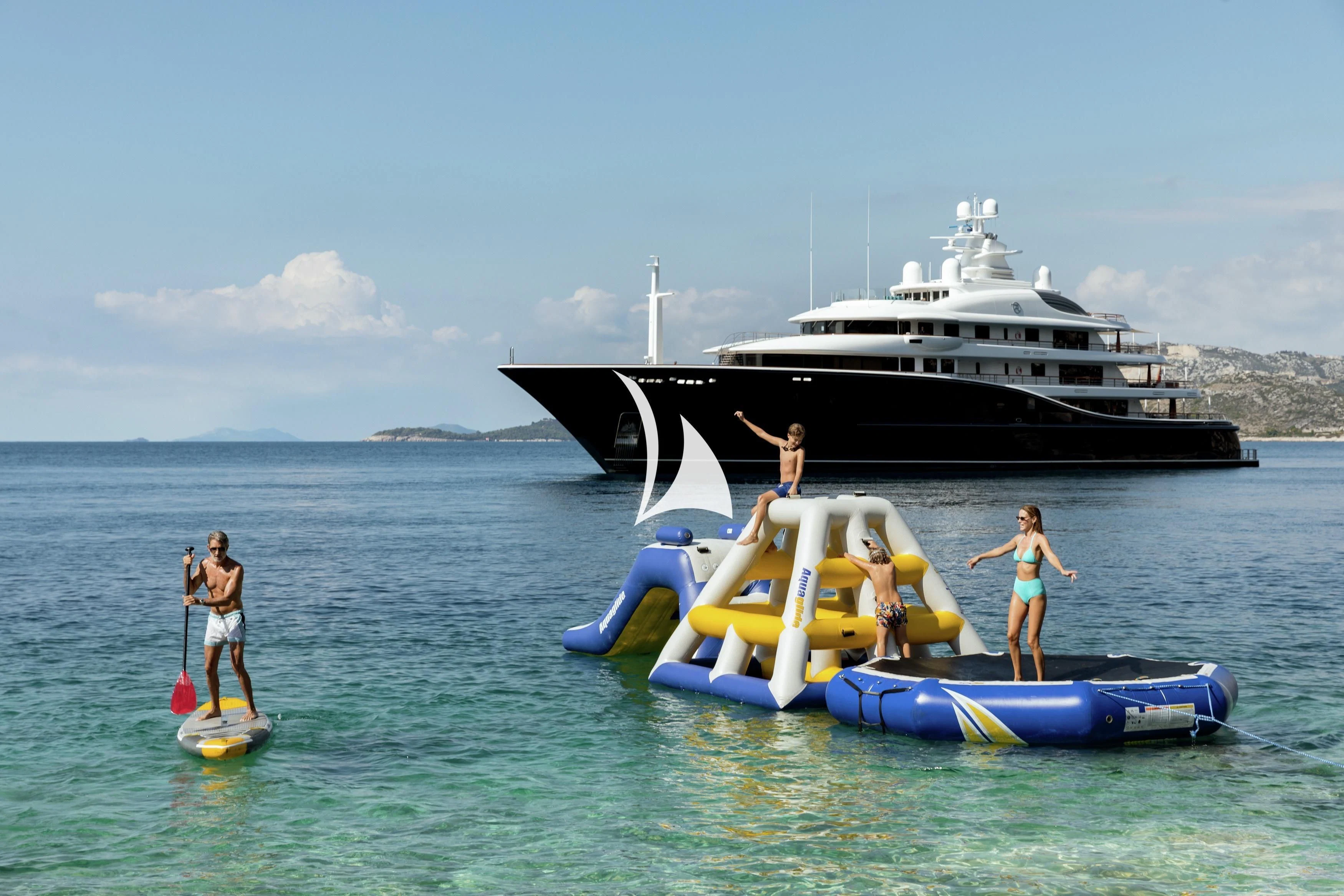people on a raft in the water aboard AQUILA Yacht for Sale