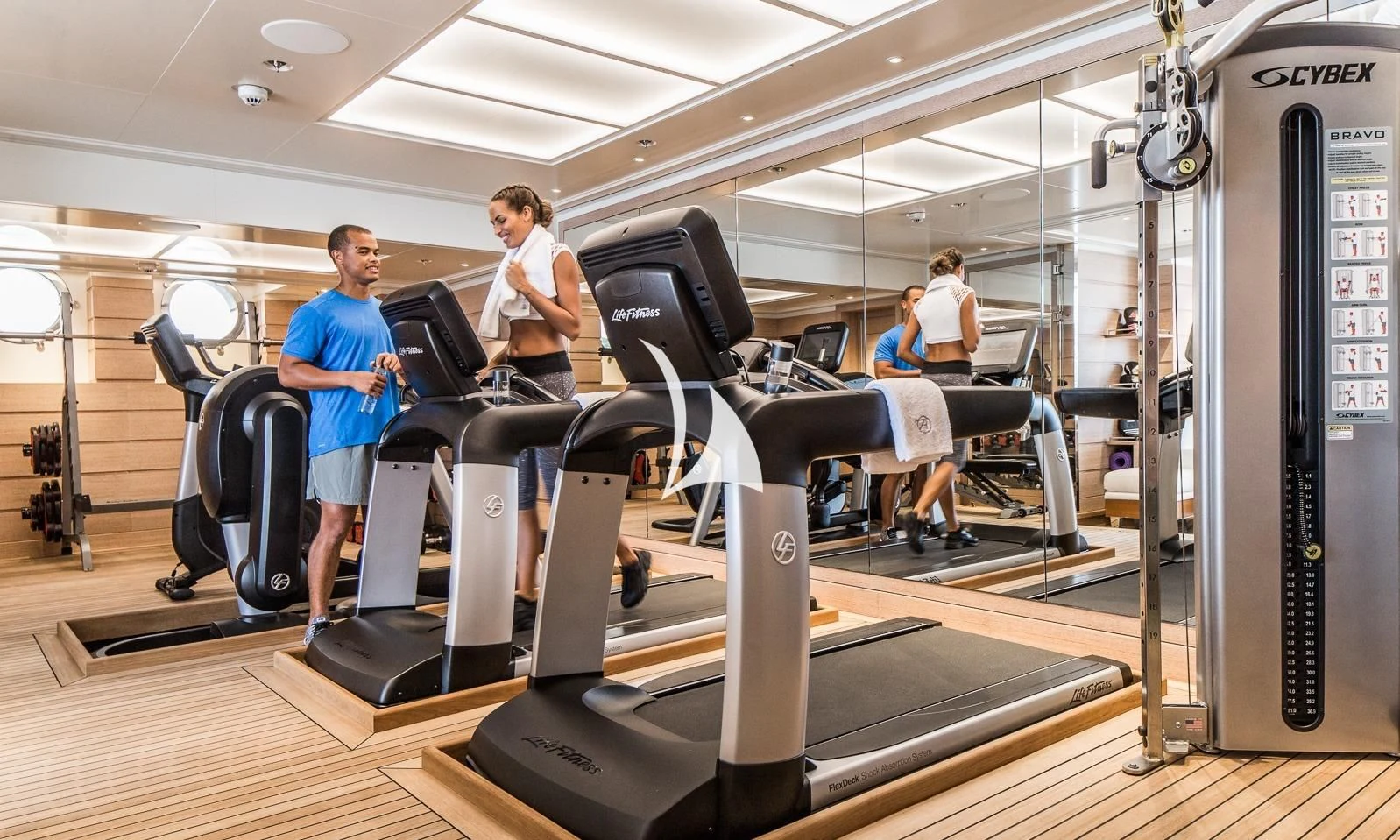 people working at a gym aboard AQUILA Yacht for Sale