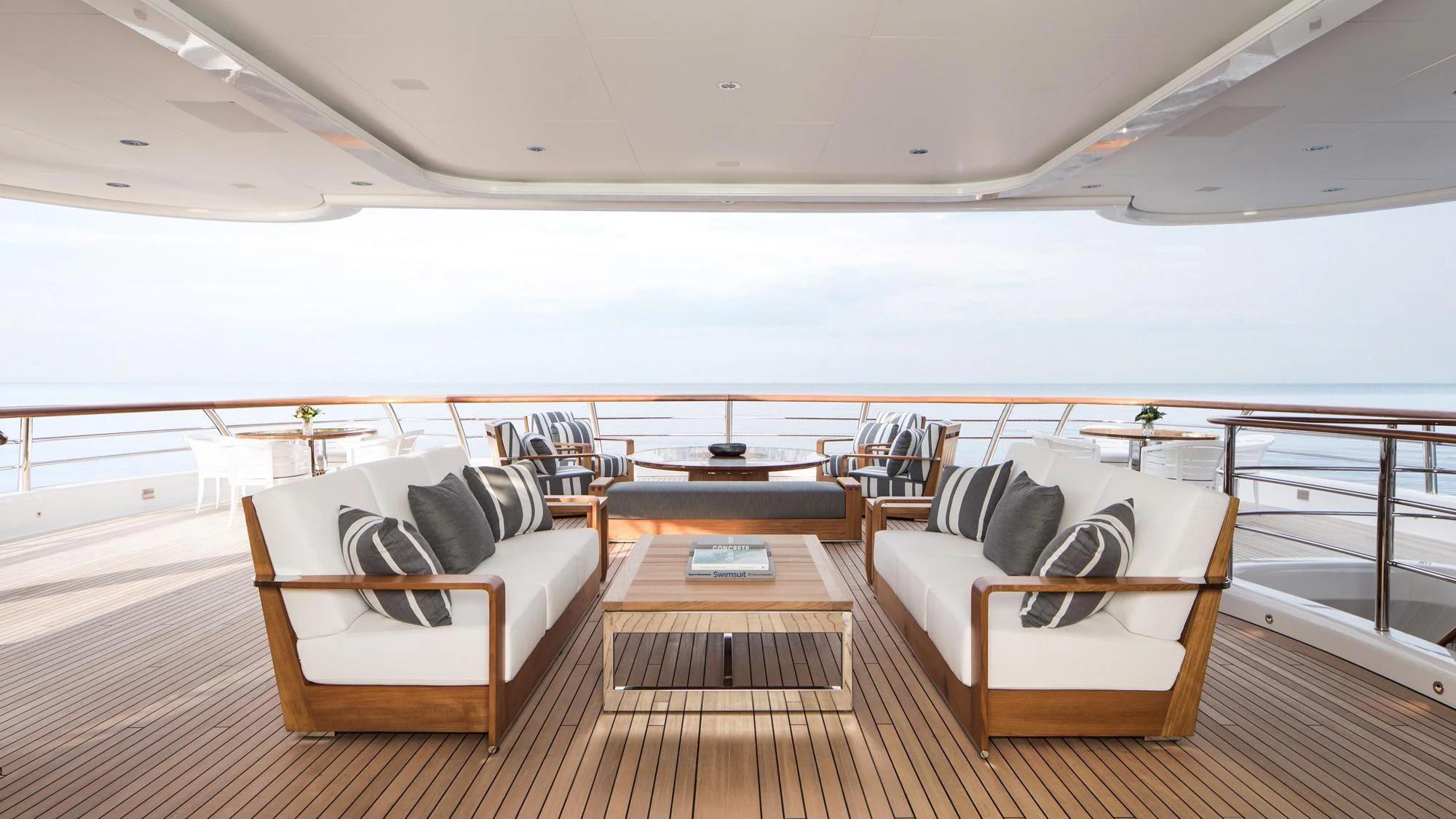 a room with a couch and a table aboard AQUILA Yacht for Sale