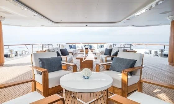 a room with a table and chairs aboard AQUILA Yacht for Sale