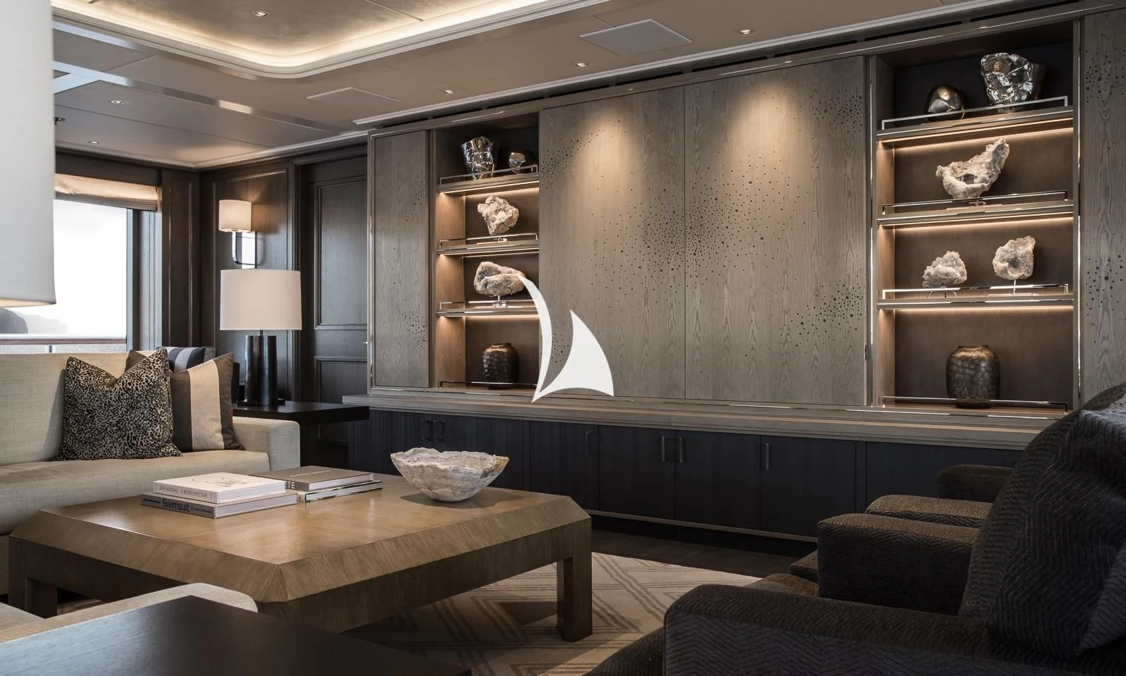 a room with a couch and a table aboard AQUILA Yacht for Sale