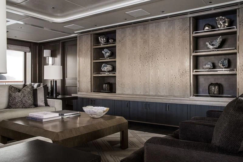 a room with a couch and a coffee table aboard AQUILA Yacht for Sale
