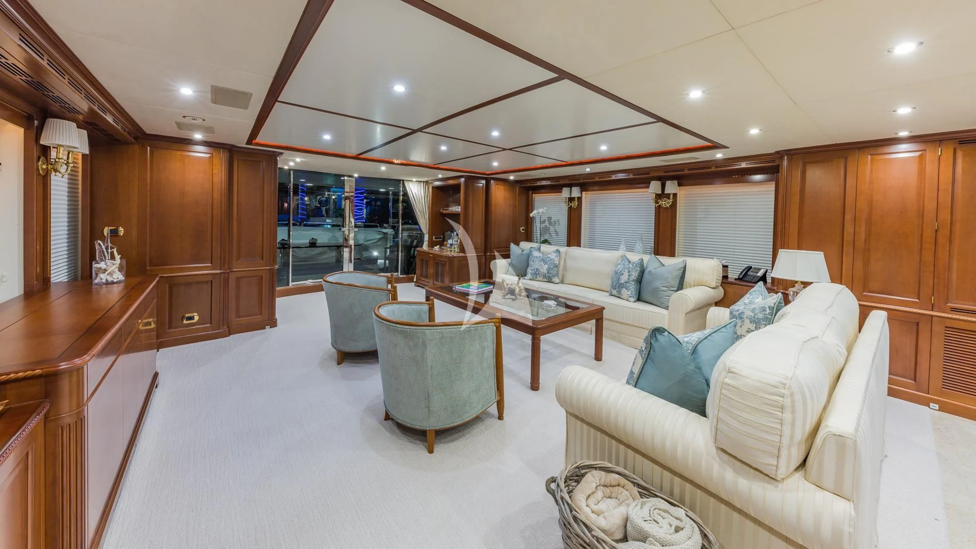 a living room with a couch and a table aboard NAMASTE Yacht for Sale