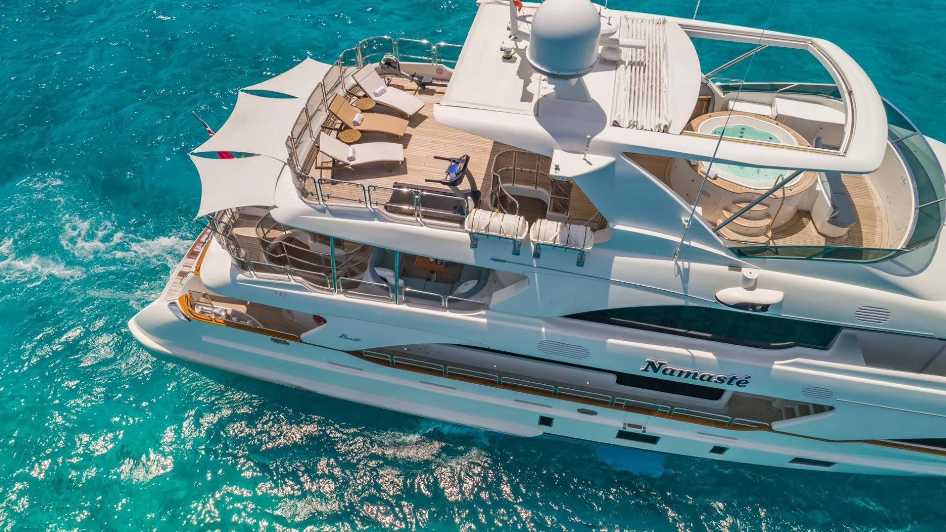 a white yacht on the water aboard NAMASTE Yacht for Sale