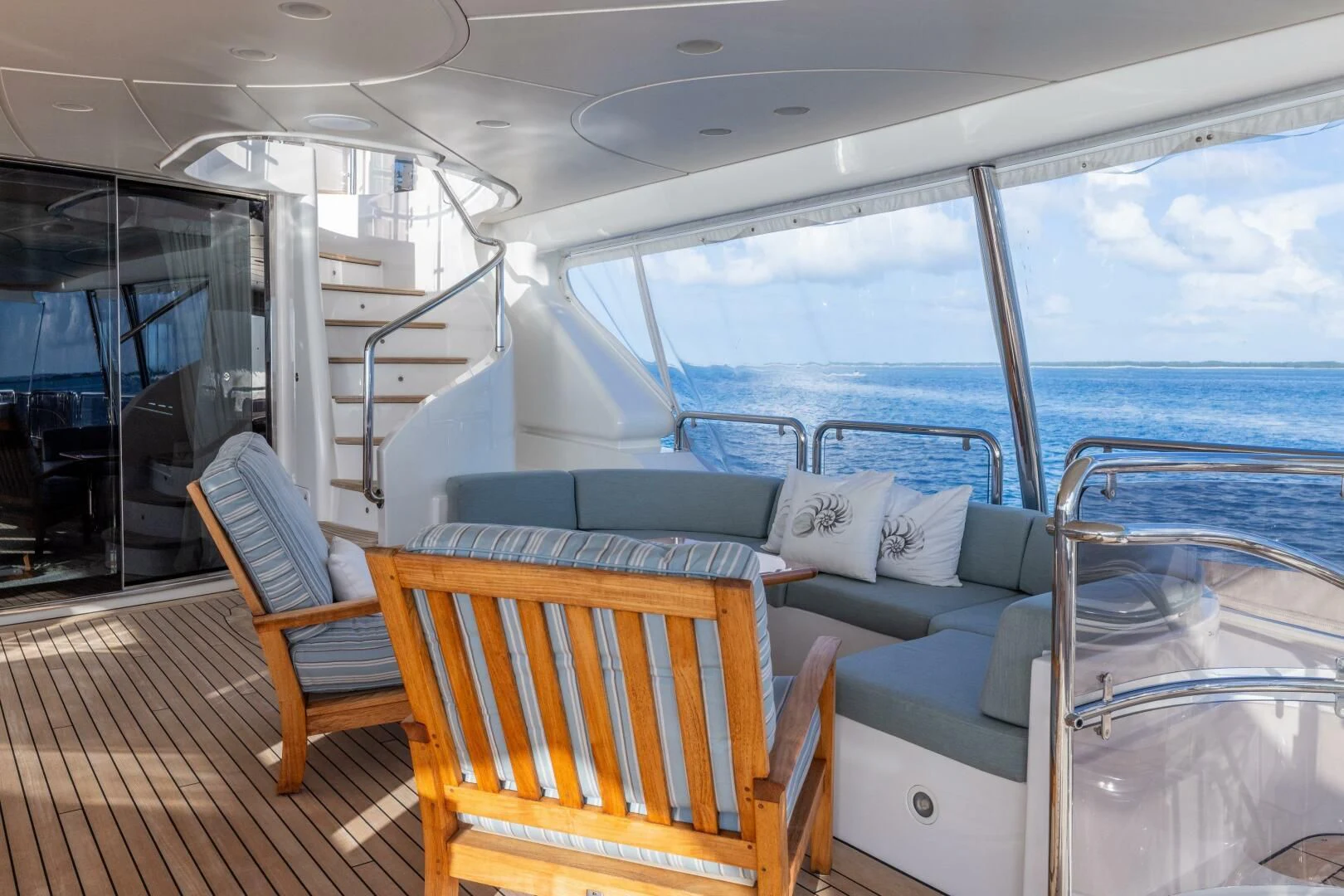 a boat with a couch and chairs aboard NAMASTE Yacht for Sale