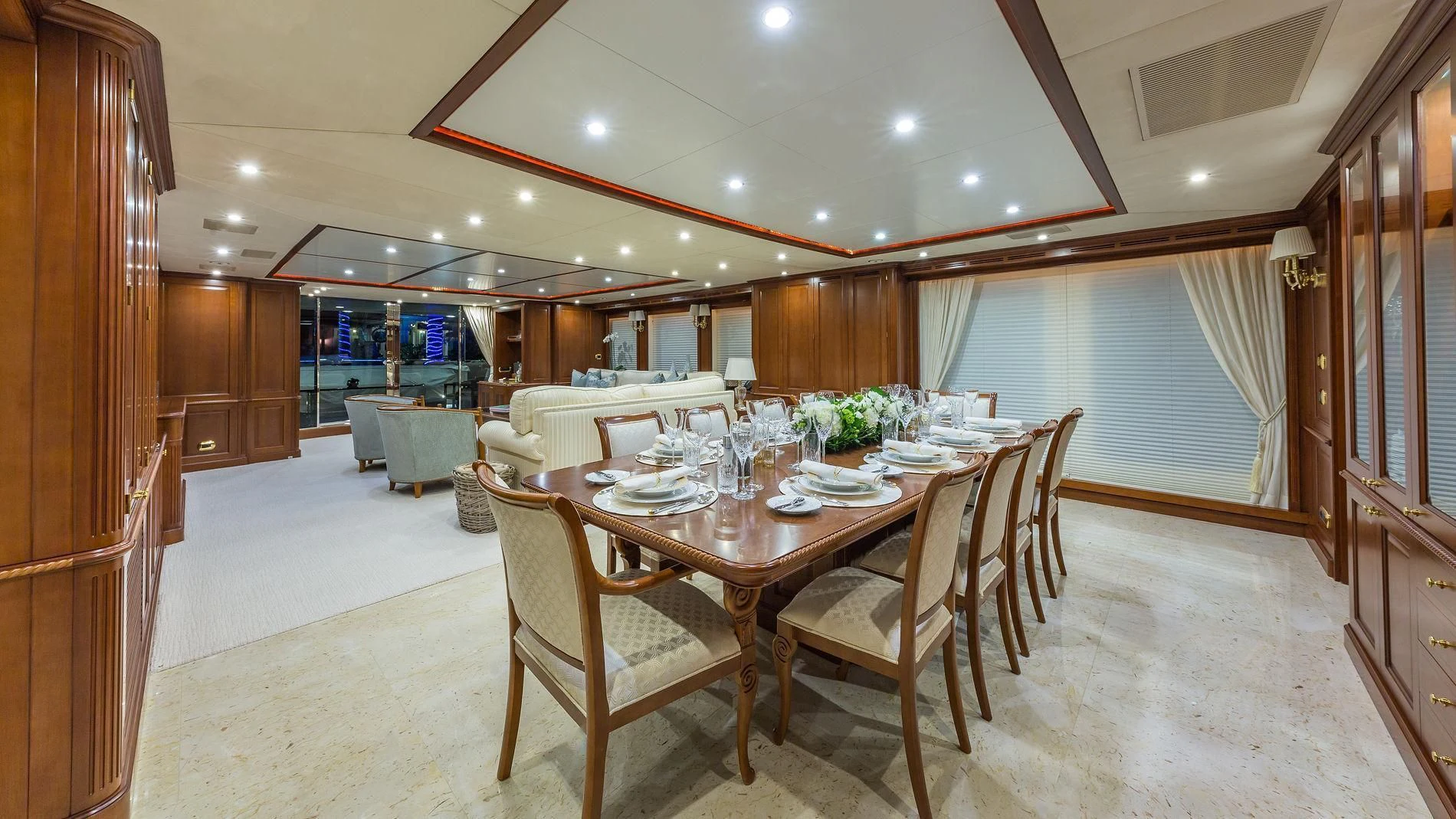 a dining room with a table and chairs aboard NAMASTE Yacht for Sale