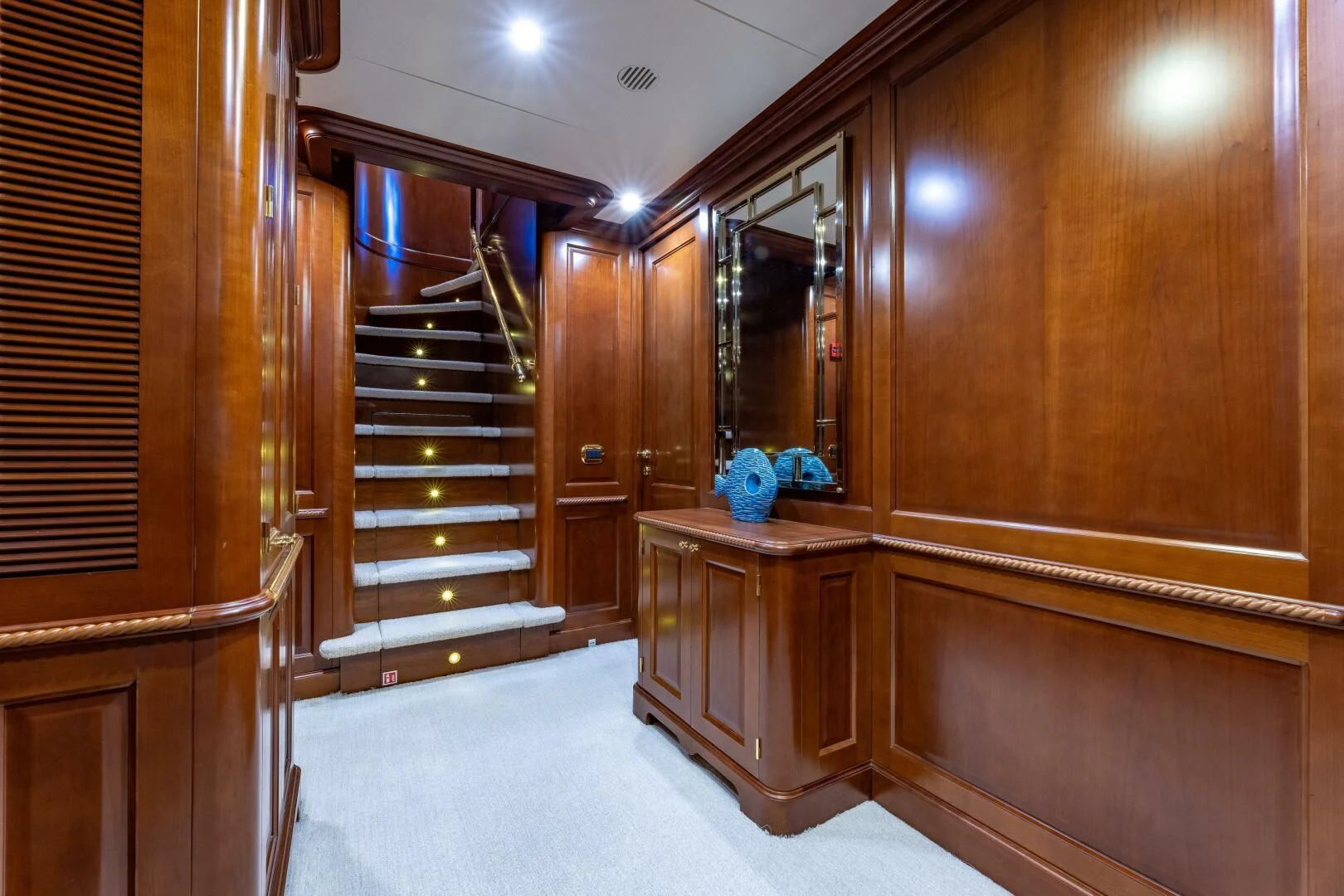 a room with wooden cabinets aboard NAMASTE Yacht for Sale