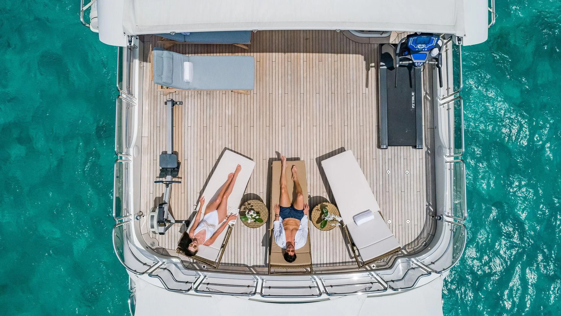 a person standing on a deck chair aboard NAMASTE Yacht for Sale