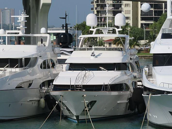 several boats are parked in a harbor aboard NAMASTE Yacht for Sale