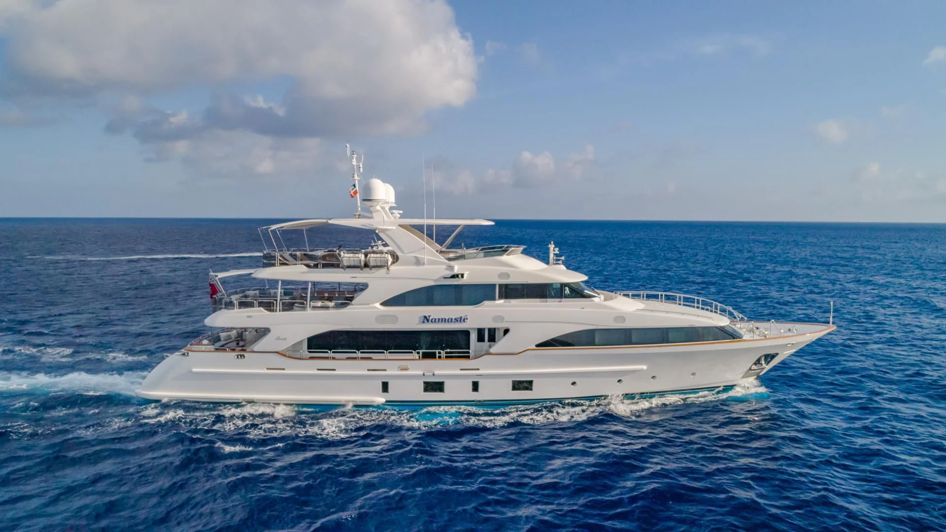 a white yacht in the ocean aboard NAMASTE Yacht for Sale