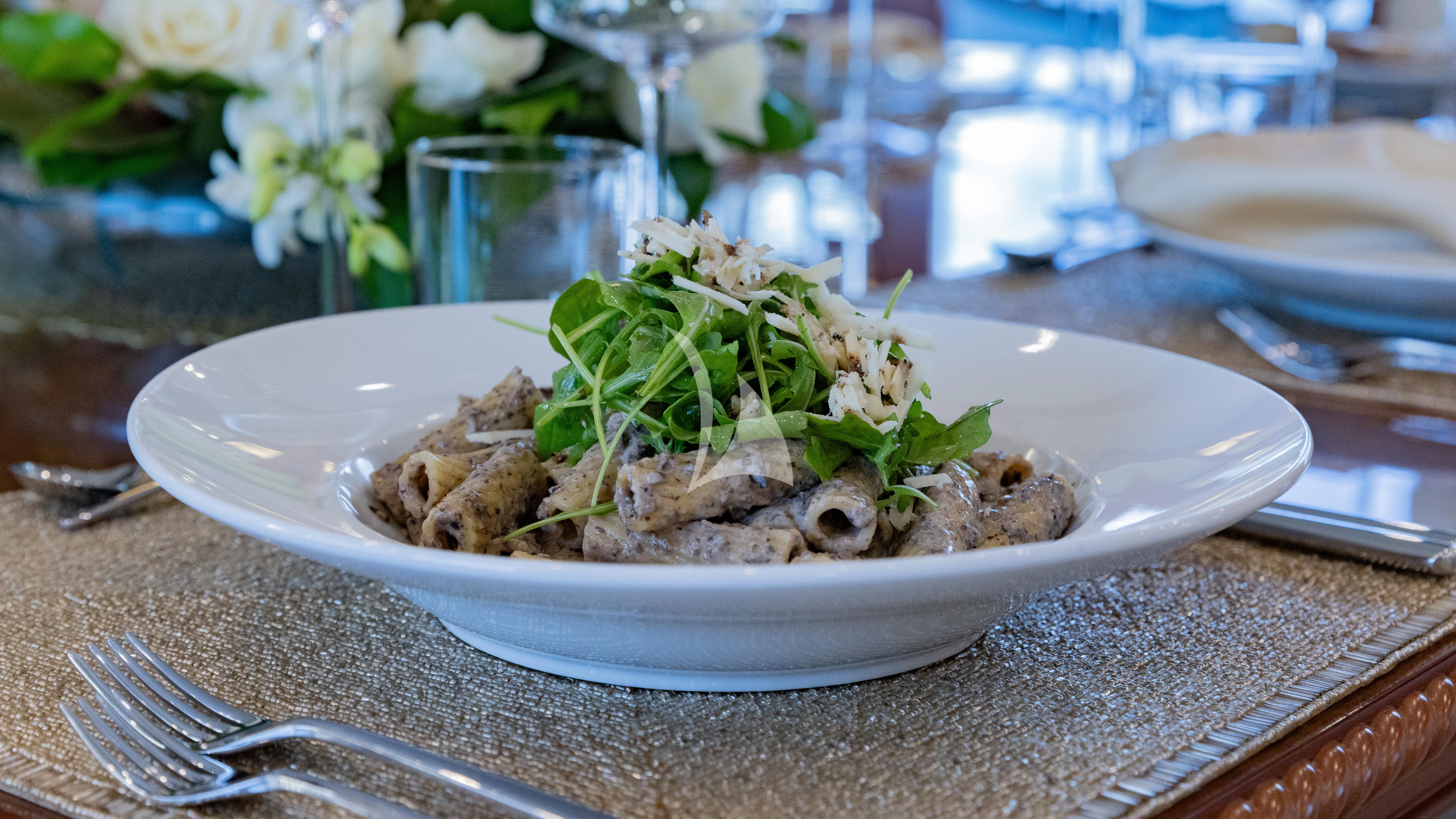 a plate of food aboard NAMASTE Yacht for Sale