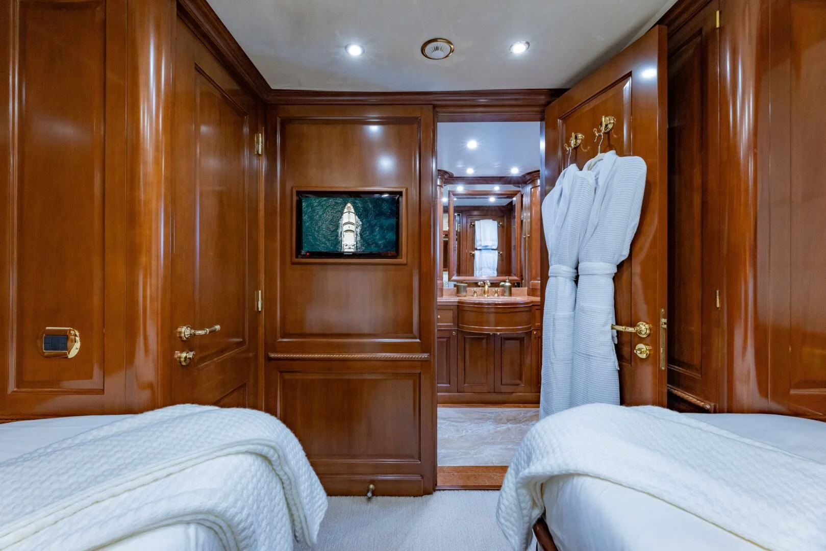 a room with a bed and a closet aboard NAMASTE Yacht for Sale