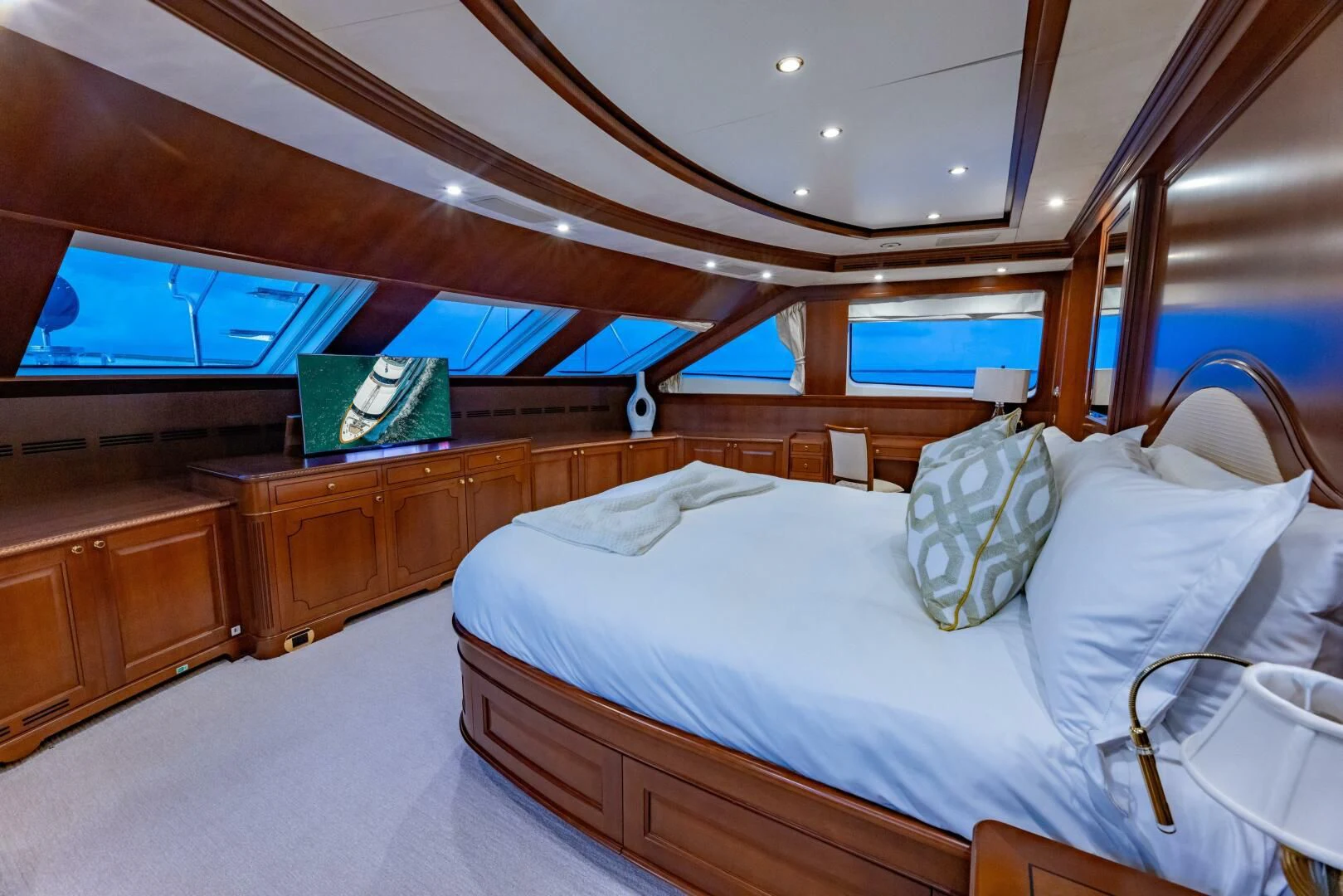 a room with a bed and a television aboard NAMASTE Yacht for Sale